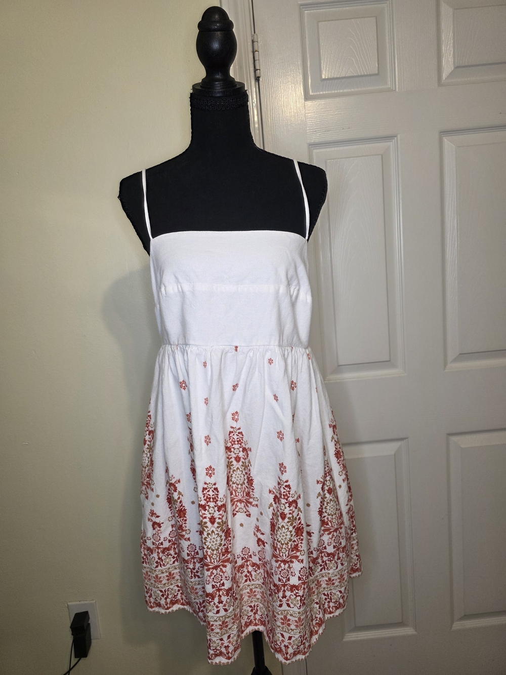 White Dress with Subtle Red Accent